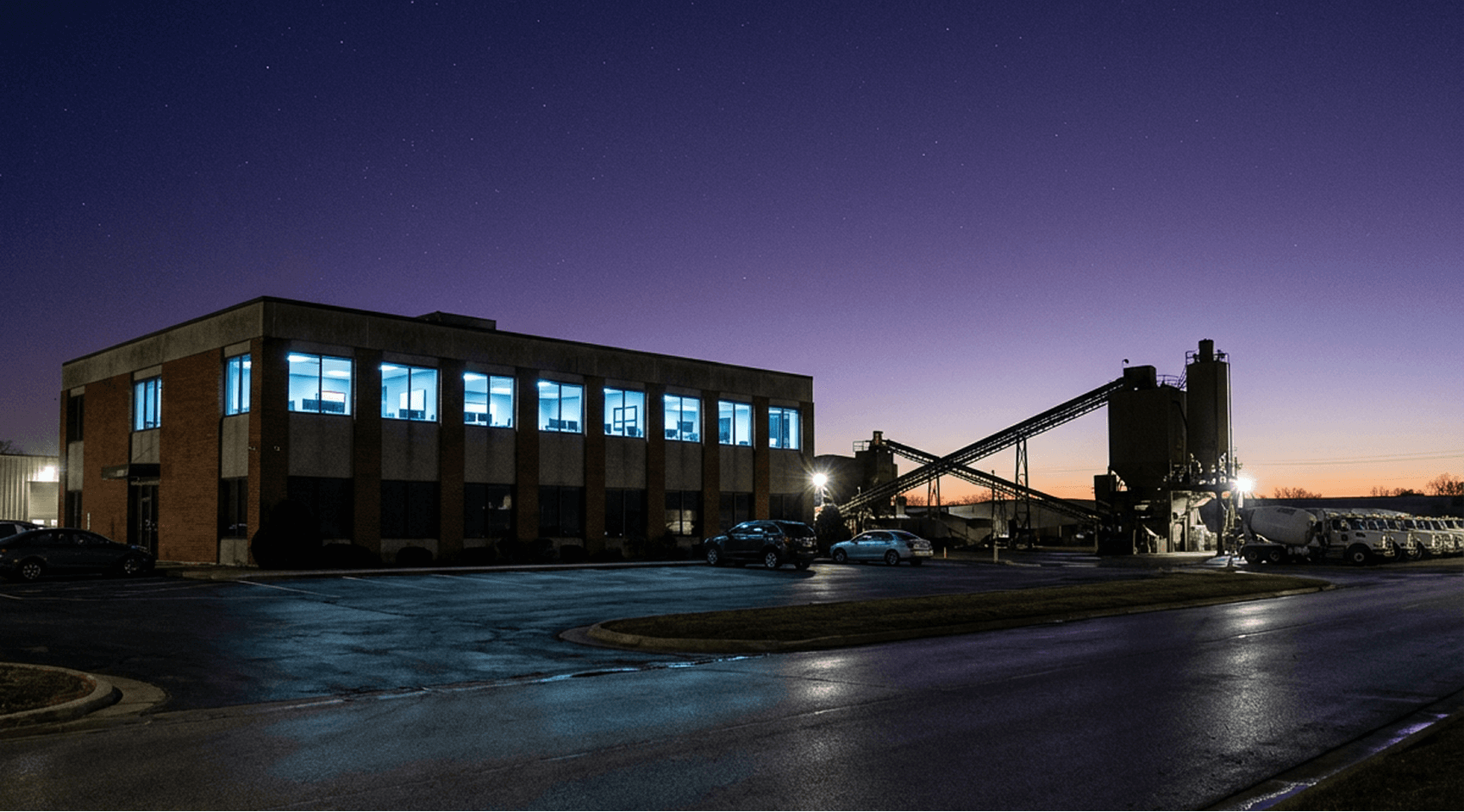 A concrete plant lit up at dusk — the operation, and the data it already generates.